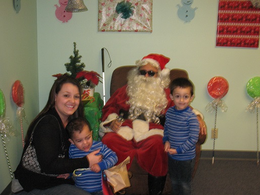 Santa posing with a family